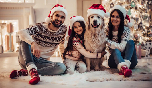 family dressed for the holidays with their dog