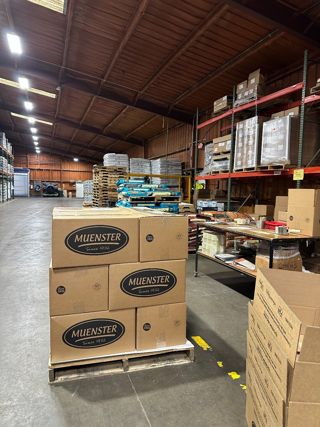 Pallets of donated Muenster dog food prepared for distribution