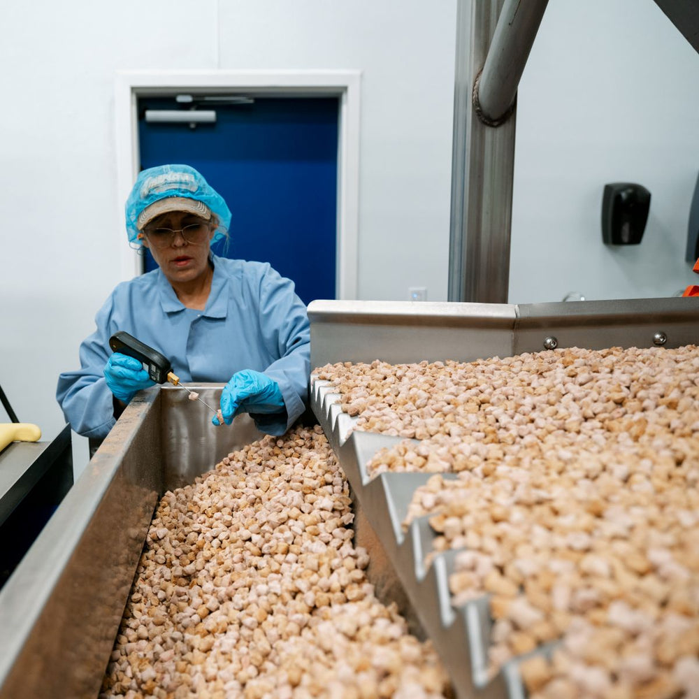 Muenster Pet team member performing a quality check during production