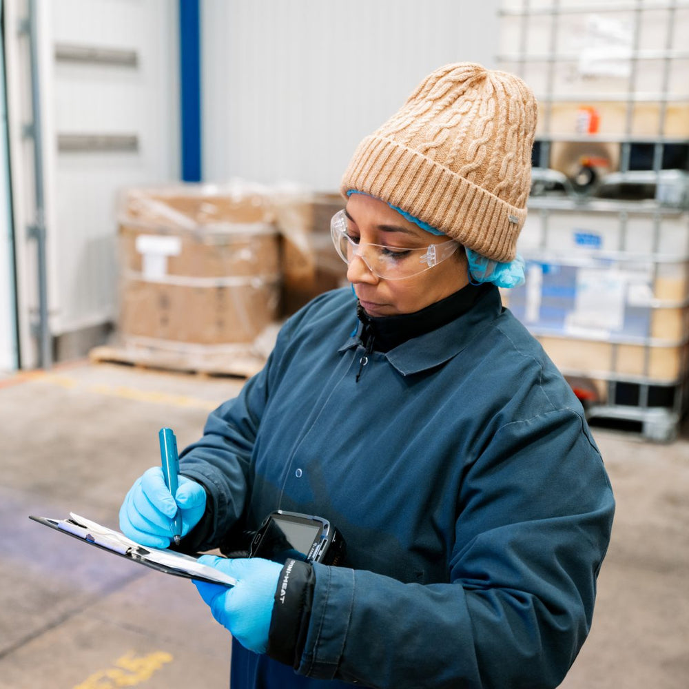 Muenster Pet team member checking the quality of ingredients in Denton, Texas